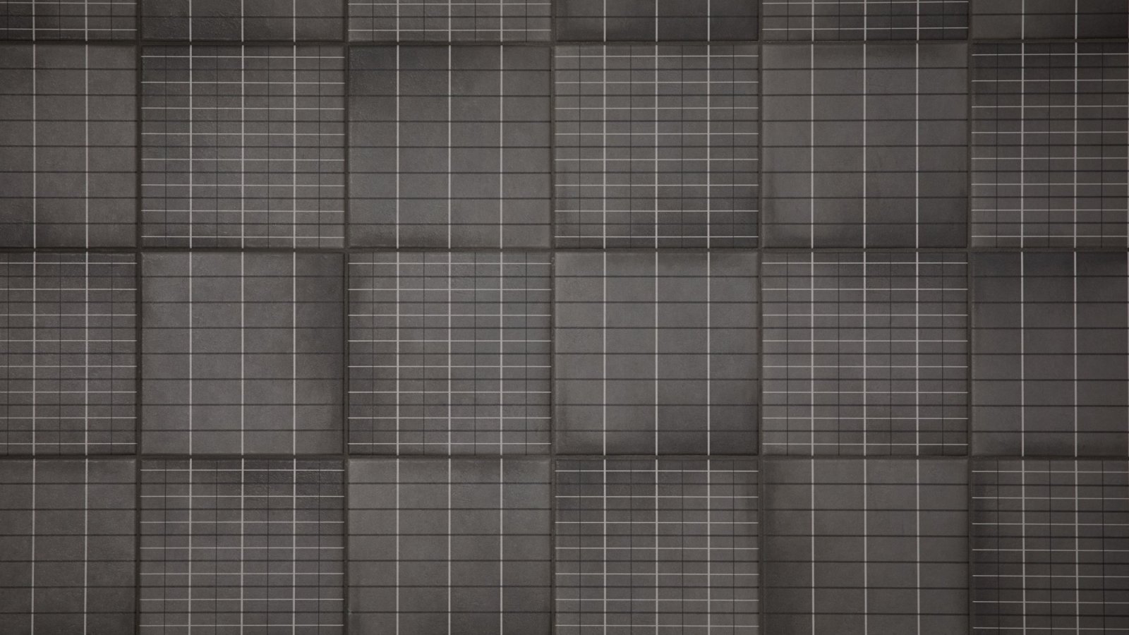 Badrumsvaegg i Aurore Charcoal Grid L fraan Mutina