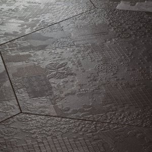 Déchirer porslinsgolv från Mutina med betongeffekt-relief